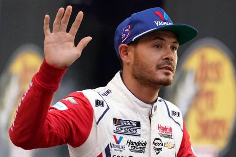 Kyle Larson waves to fans before a NASCAR Cup Series auto race at Bristol Motor Speedway Saturd ...