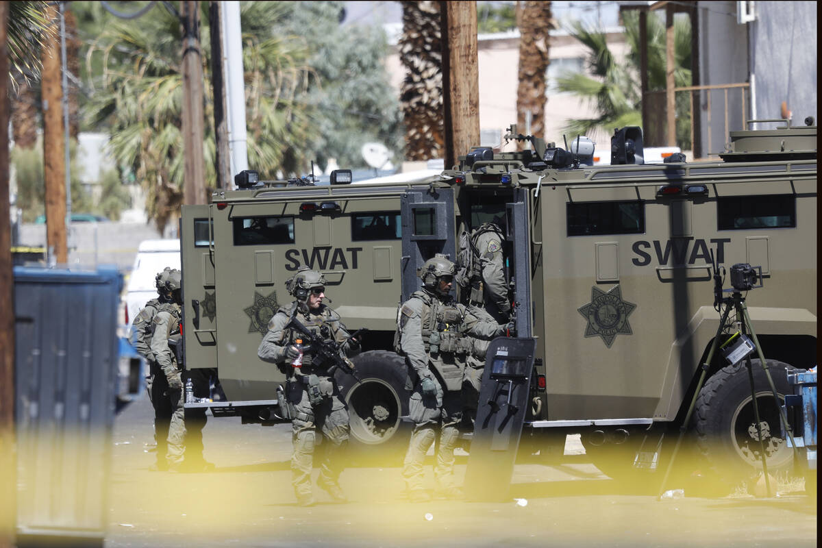 A heavy police presence is visible around a house in the 300 block of South 11th Street, Tuesda ...