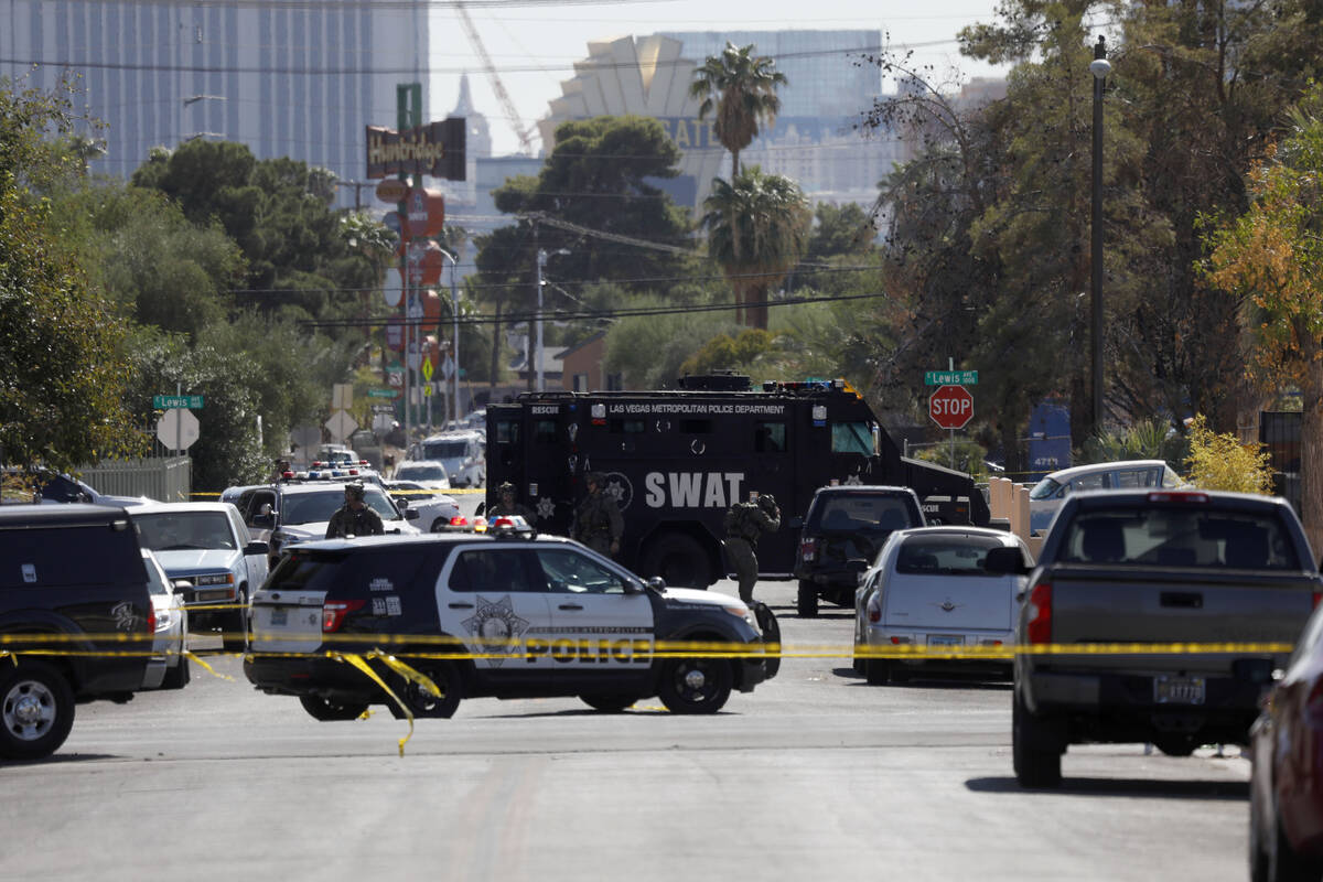 A heavy police presence is visible around a house in the 300 block of South 11th Street, Tuesda ...