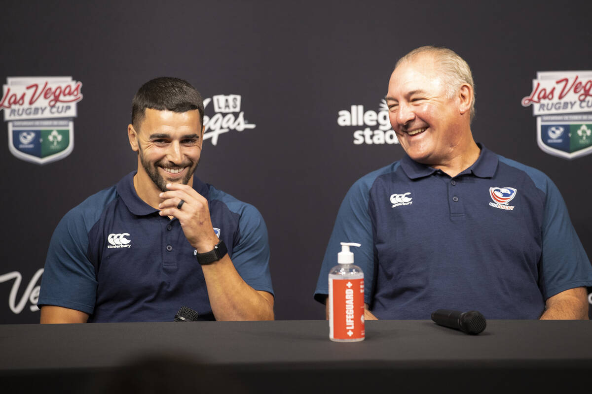 USA Eagles players Nate Augspurger, left, with USA Rugby's head coach Gary Gold, participate du ...