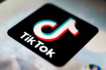 A logo of a smartphone app TikTok is seen on a user post on a smartphone screen. (AP Photo/Kiic ...