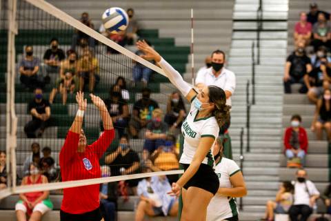 Rancho's Summer Martin (5) kills the ball while Western's Mia Perez (8) jumps to block during t ...