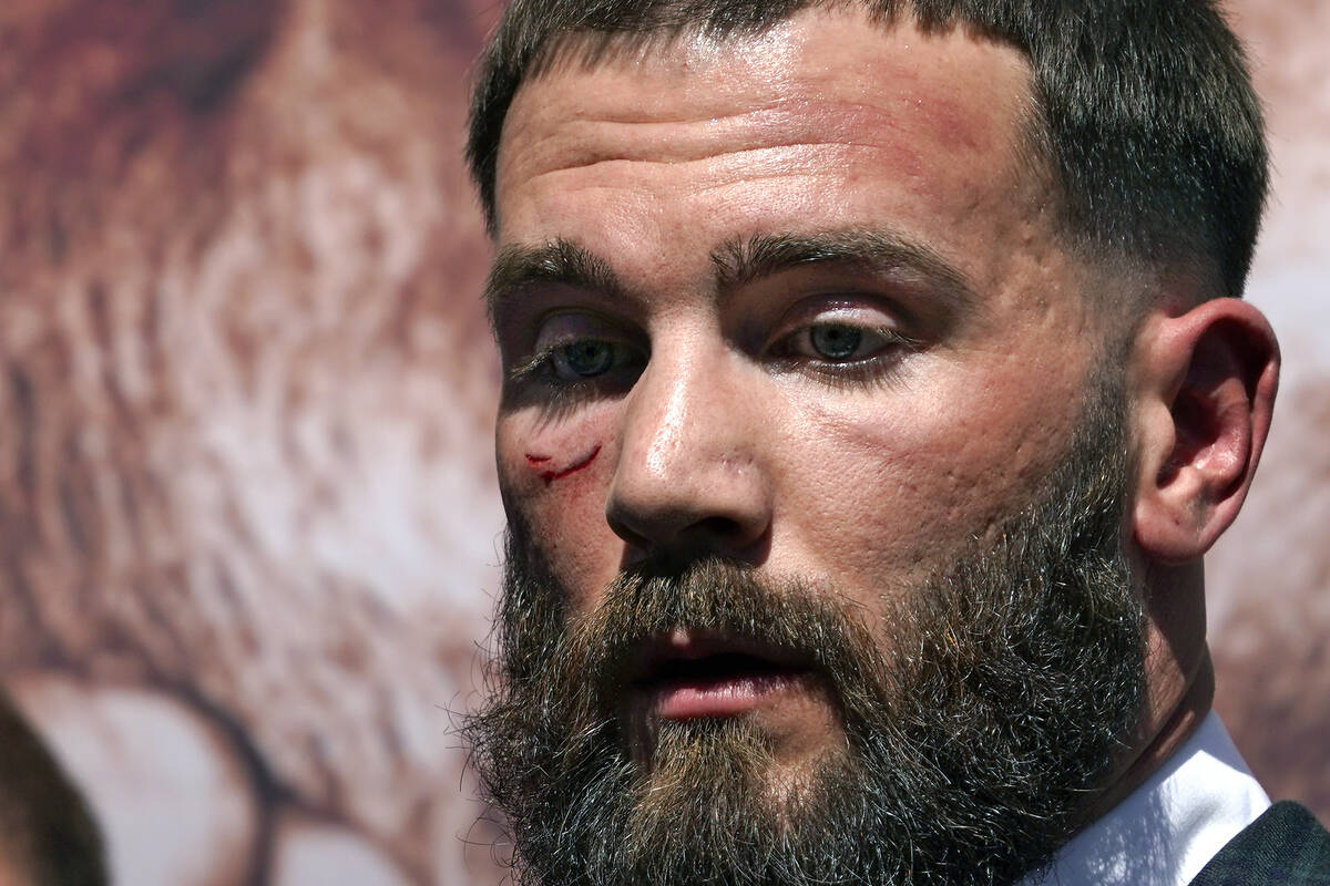 Undefeated IBF Super Middleweight Champion Caleb Plant is seen with a cut under his eye after a ...