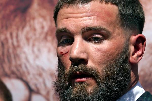 Undefeated IBF Super Middleweight Champion Caleb Plant is seen with a cut under his eye after a ...