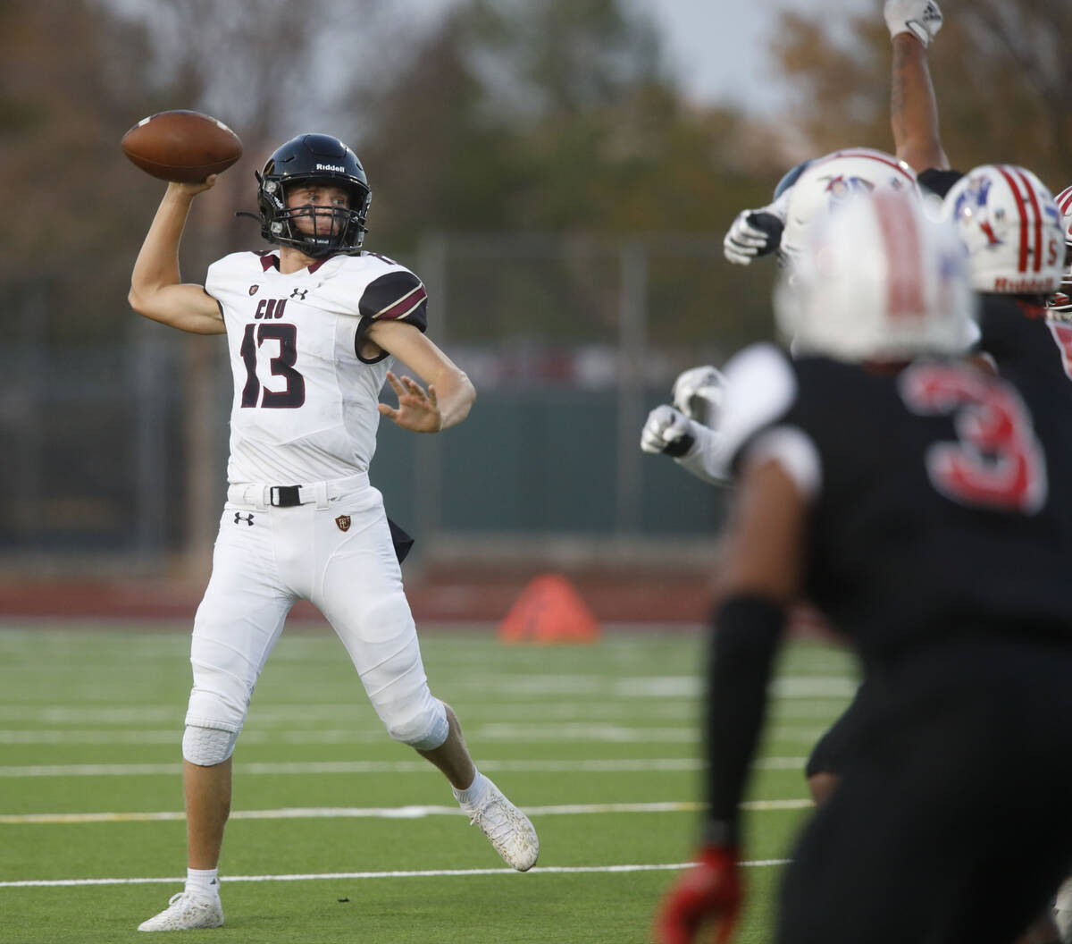 Faith Lutheran High School's quarterback Rylan Walter (13) throws a pass against Liberty High S ...