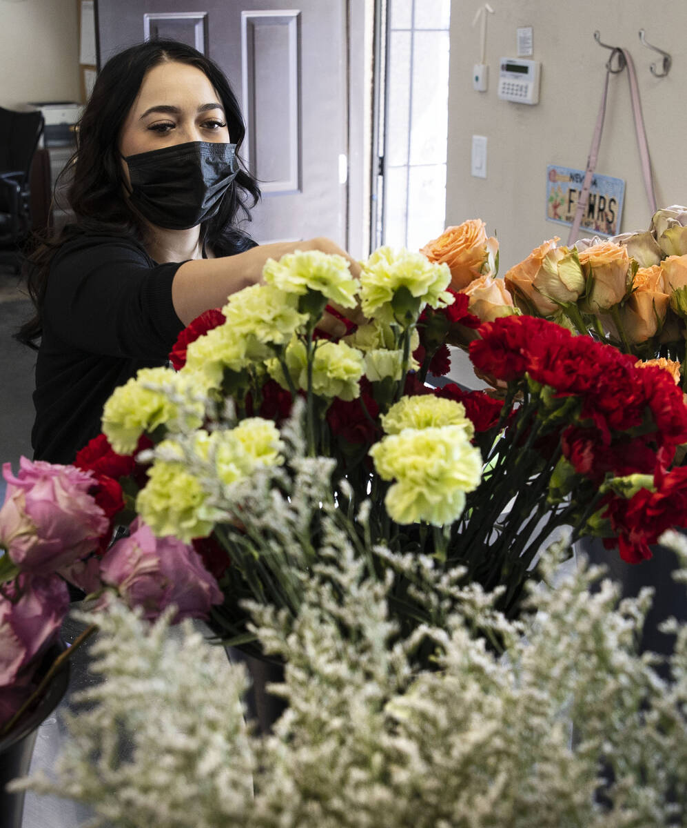 Theresa Arana, head florist at Chapel of the Flowers, arranges flowers, on Wednesday, Sep. 22, ...