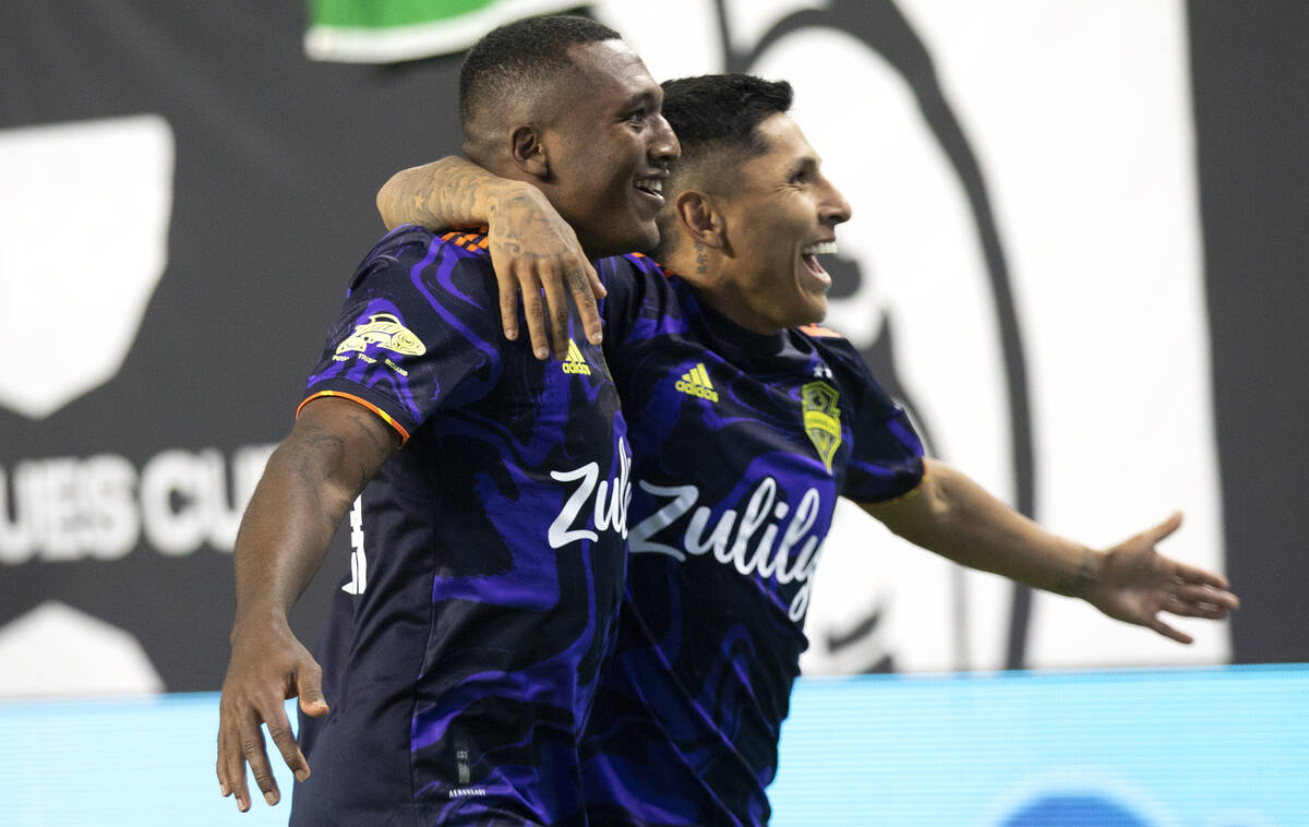 Seattle Sounders midfielder Jimmy Medranda (94) and forward Raul Ruidiaz (9) celebrate a goal s ...