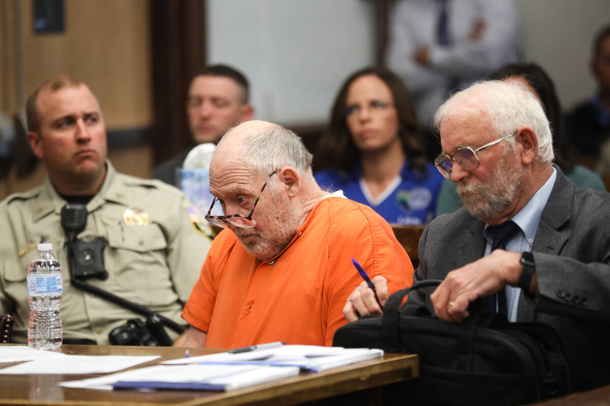 John Dabritz, center, waits during his sentencing hearing next to defense attorney Richard Sear ...