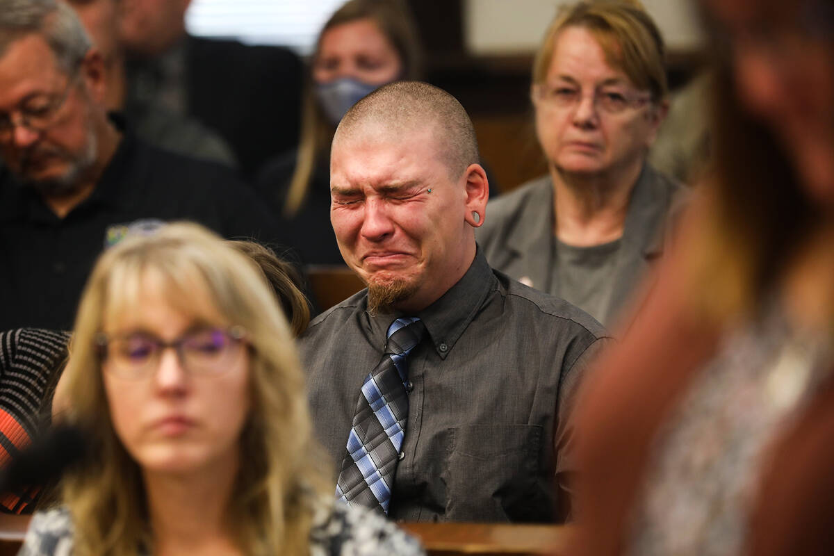 Michael Jenkins, elder son of slain Nevada Highway Patrol Sgt. Ben Jenkins, reacts as his mothe ...