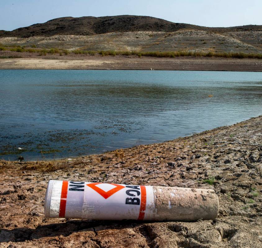 A buoy on the shore from low water near Boulder Harbor at Lake Mead National Recreation Area on ...