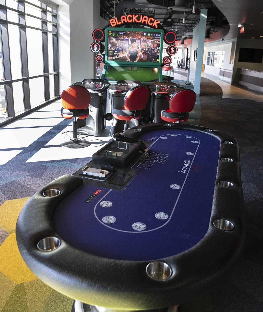 A gaming table and a video blackjack machine are displayed at the Black Fire Innovation center ...
