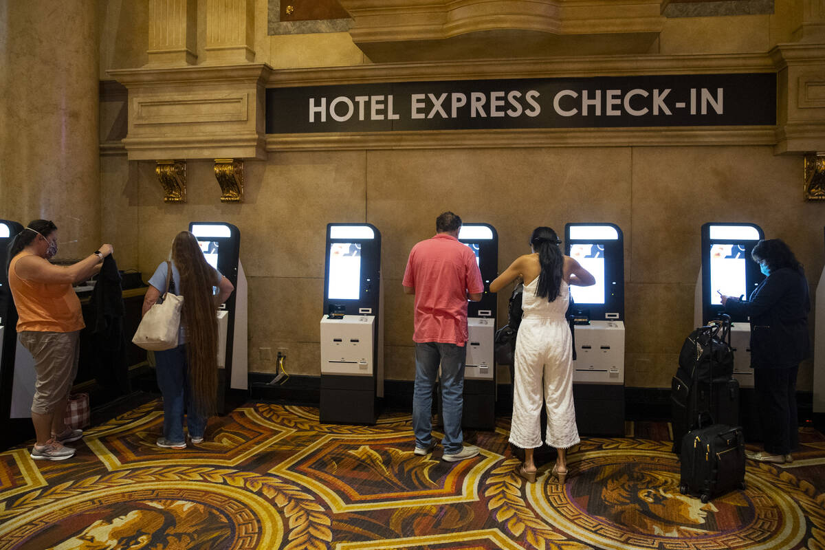 Guests use new resort technology to check-in at the Caesars Palace hotel-casino in Las Vegas, T ...