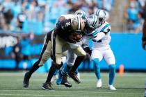 New Orleans Saints quarterback Jameis Winston (2) is sacked by Carolina Panthers defensive end ...