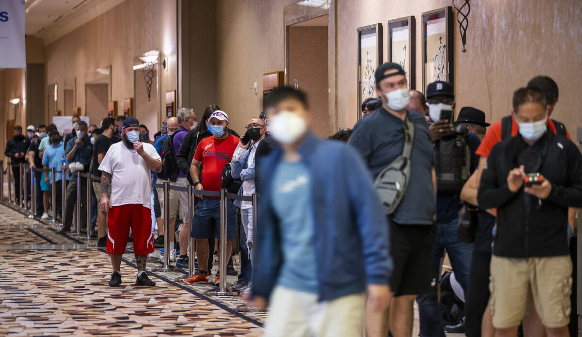 Players wait in line to register for events on the first day of the World Series of Poker at th ...