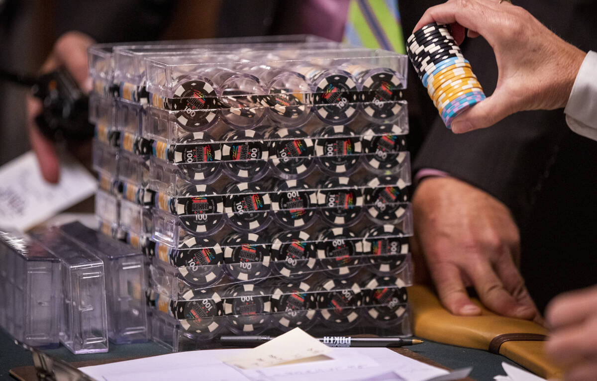 Chips are doled out during a $500 casino employees event on the first day of the World Series o ...
