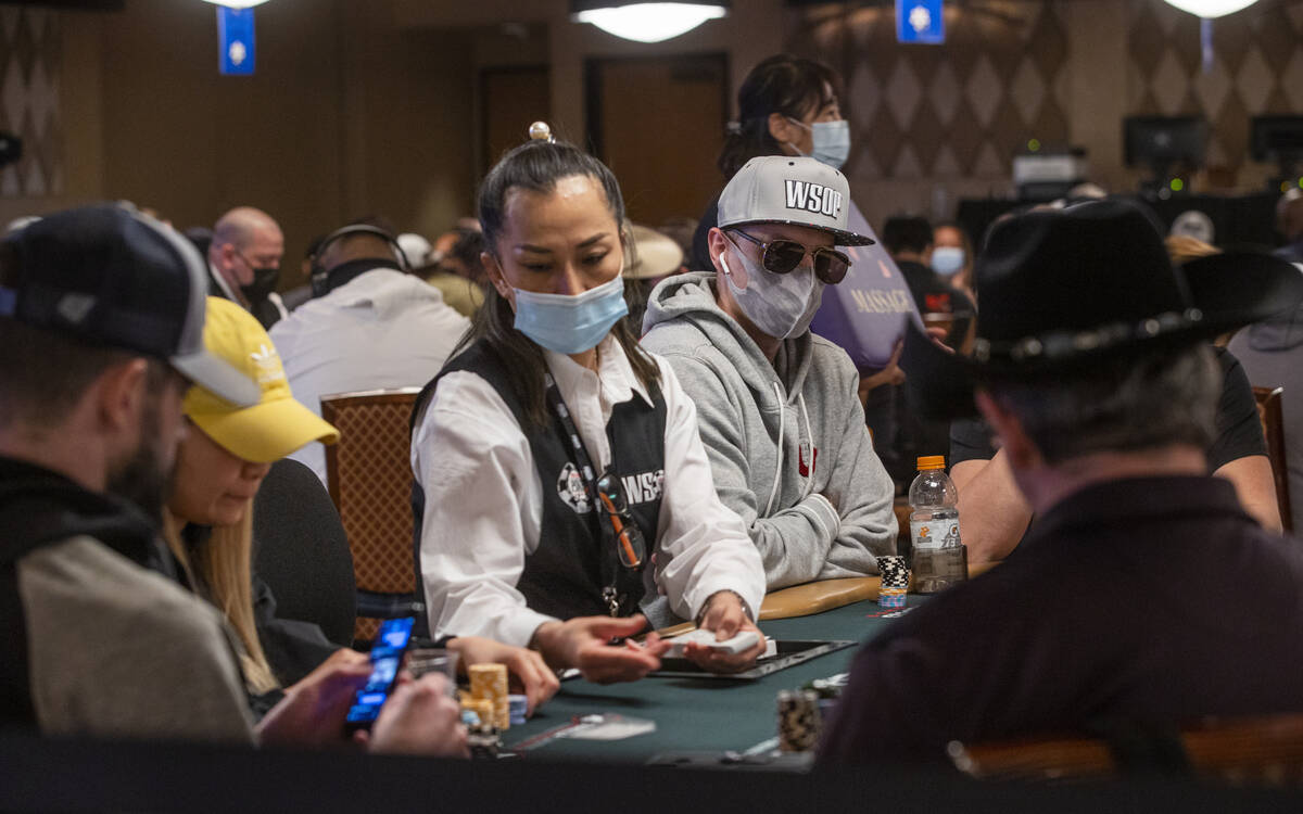 Players sport a variety of hats during a $500 casino employees event on the first day of the Wo ...