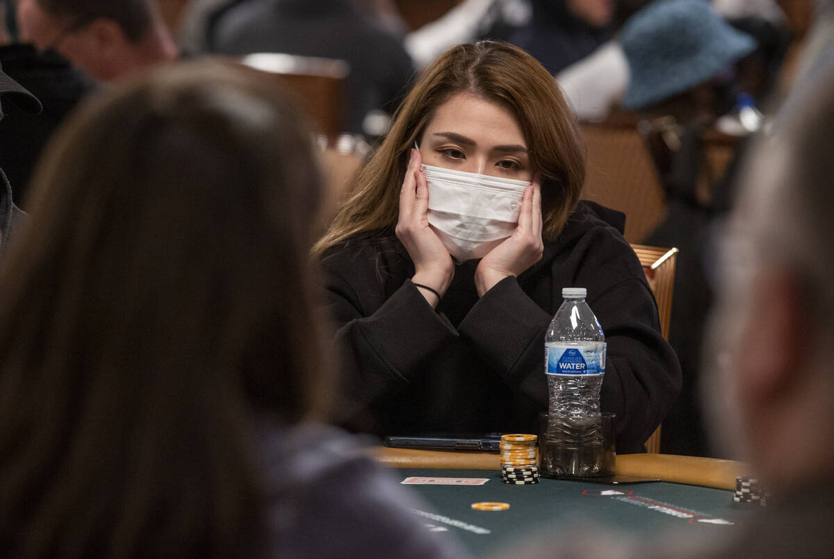 Player Emi Painter of Las Vegas waits her turn to bet during a $500 casino employees event on t ...