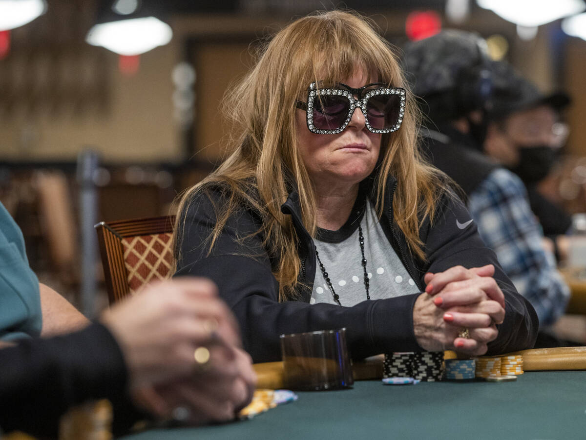 A player in fancy shades waits on the dealer during a $500 casino employees event on the first ...
