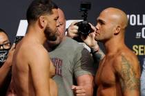 Nick Diaz, left, and Robbie Lawler pose during a ceremonial weigh-in for a UFC 266 mixed martia ...