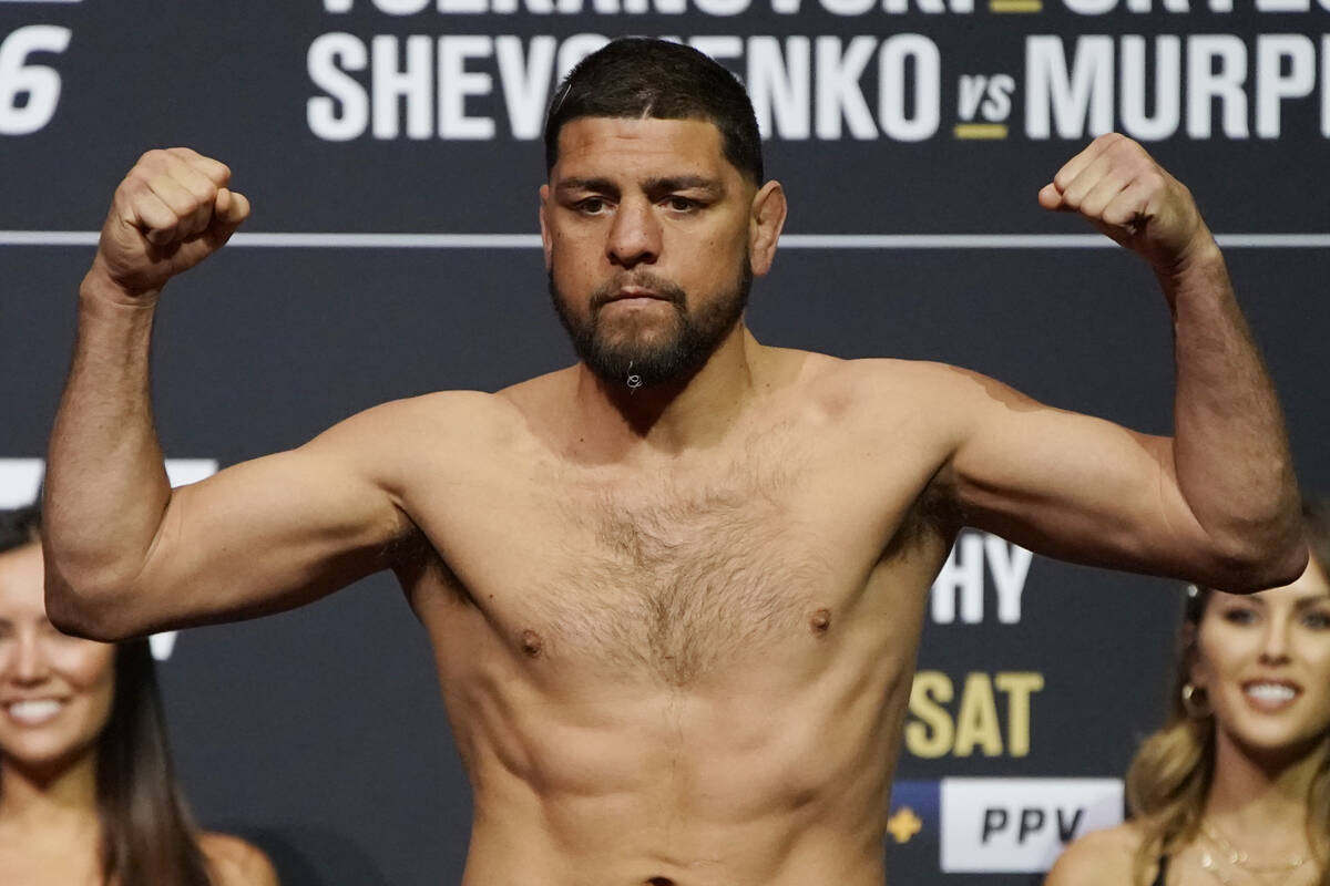 Nick Diaz poses during a ceremonial weigh-in for a UFC 266 mixed martial arts bout Friday, Sept ...