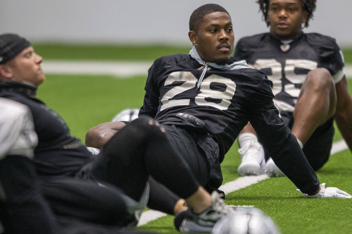 Raiders running back Josh Jacobs (28) stretches during team practice at the Raiders Headquarter ...