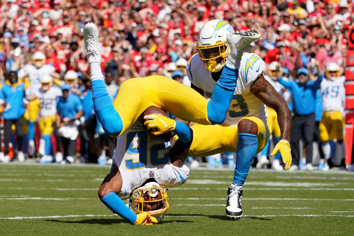Los Angeles Chargers' Asante Samuel Jr. (26) makes an interception during the first half of an ...