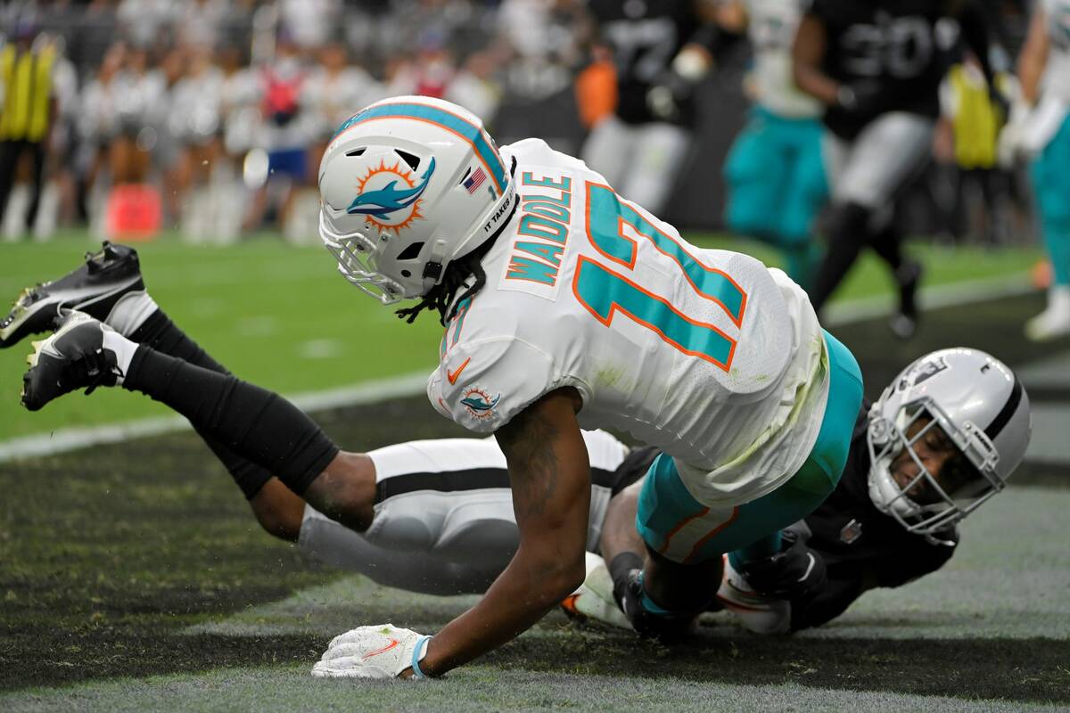 Las Vegas Raiders cornerback Casey Hayward (29) tackles Miami Dolphins wide receiver Jaylen Wad ...
