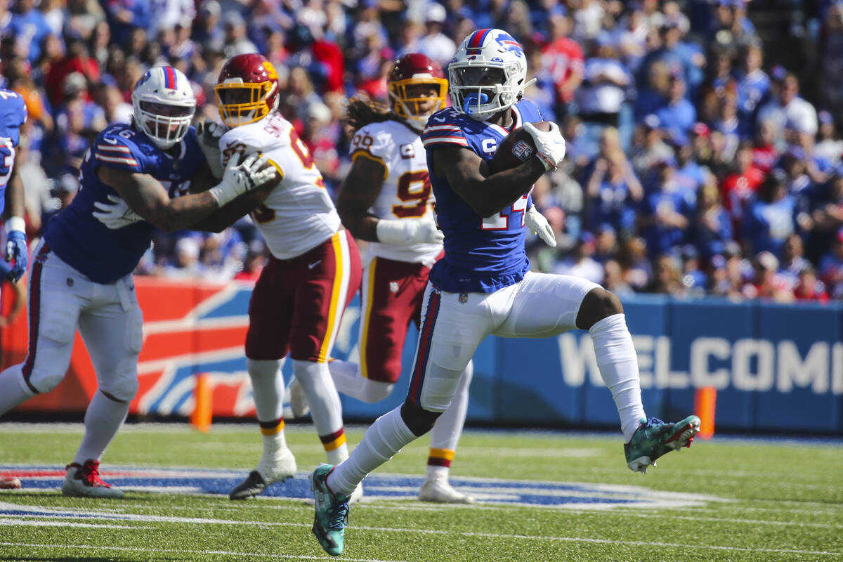 Buffalo Bills' Stefon Diggs (14) runs for yards after catch during the first half of an NFL foo ...