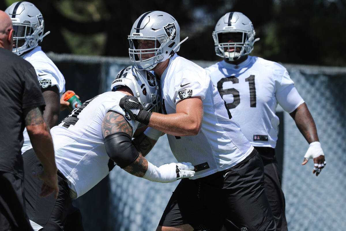 Oakland Raiders center Richie Incognito (64) and offensive tackle Kolton Miller (74) drill duri ...