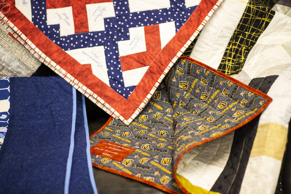 Donated quilts that will be given away to survivors, relatives and first responders affected in ...