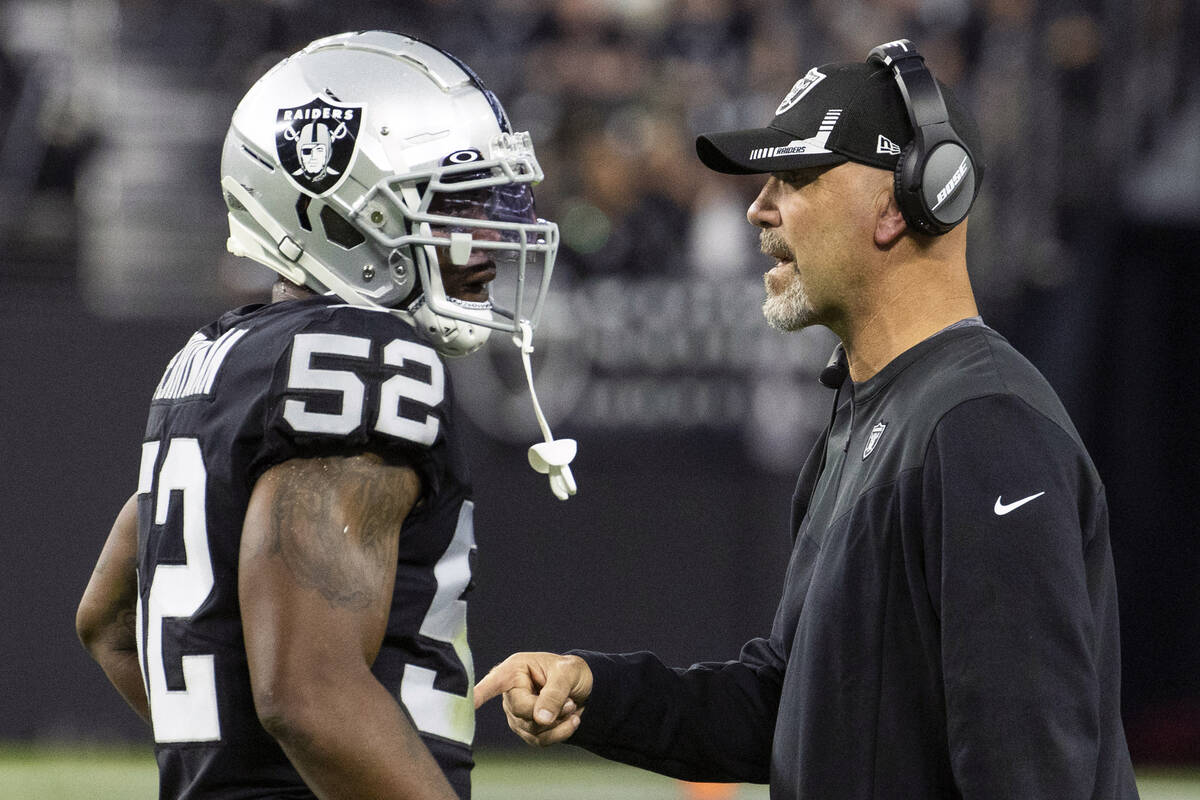 Raiders middle linebacker Denzel Perryman (52) hears from defensive coordinator Gus Bradley dur ...