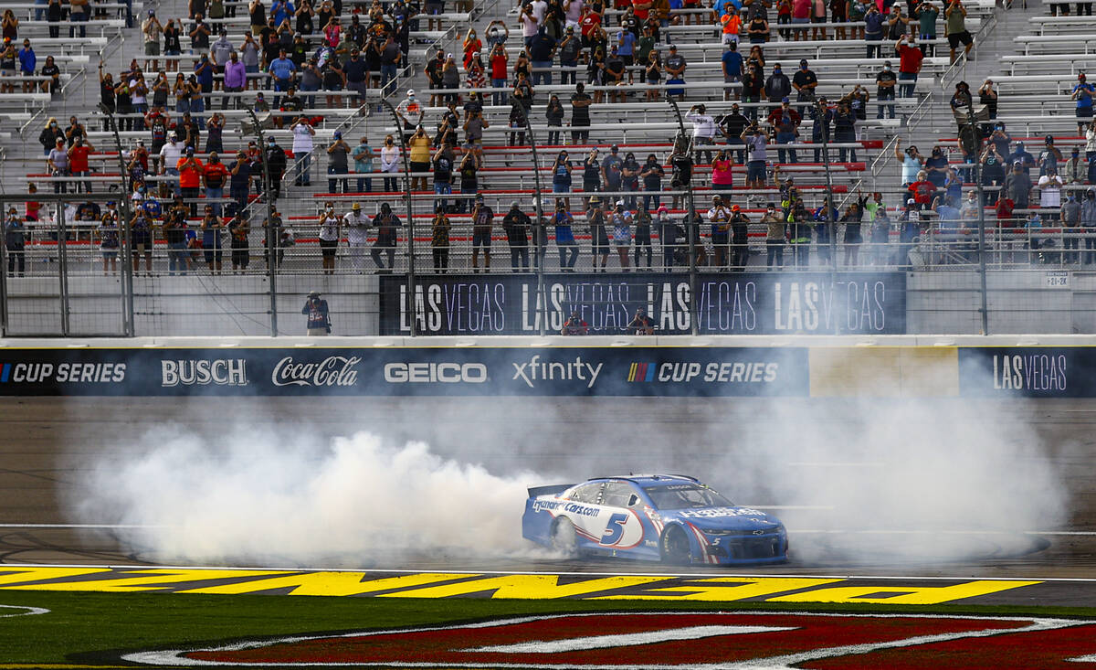 Kyle Larson does a burnout after winning the NASCAR Cup Series Pennzoil 400 auto race at the La ...