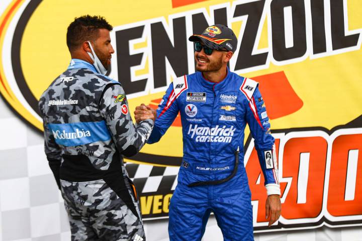 Bubba Wallace, left, congratulates Kyle Larson on his win in the NASCAR Cup Series Pennzoil 400 ...