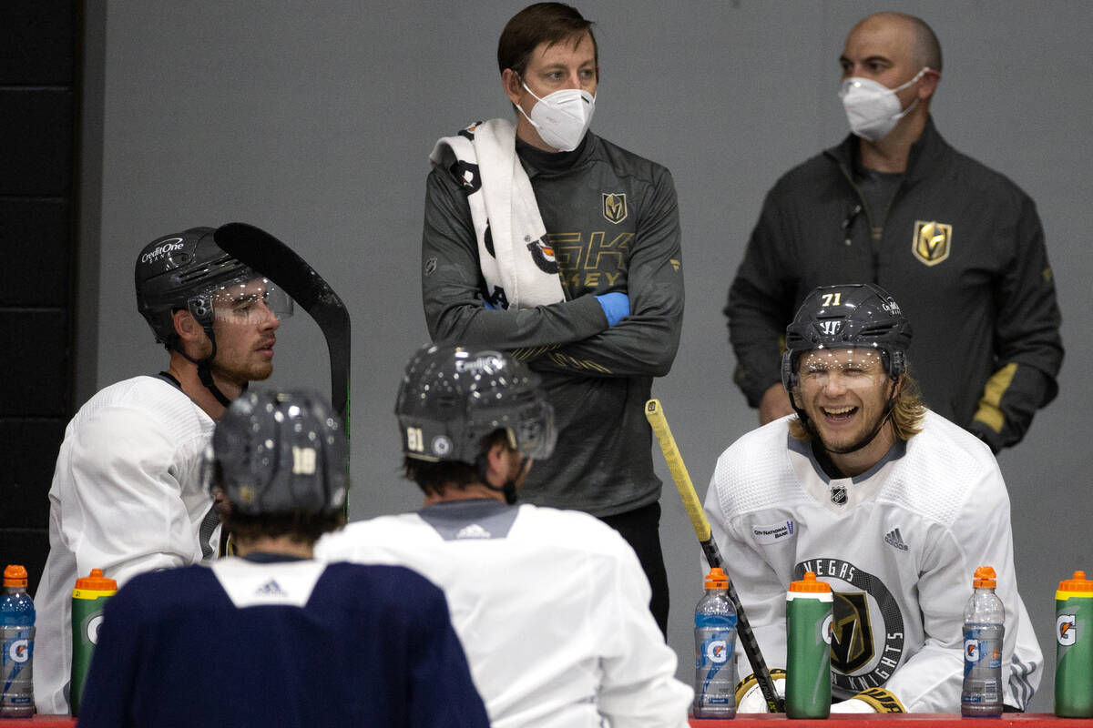Golden Knights center William Karlsson (71) laughs alongside right wing Reilly Smith (19) and c ...