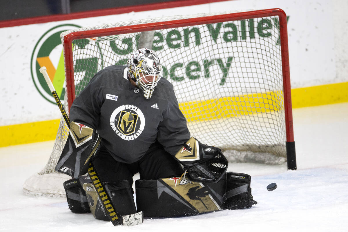 Golden Knights goaltender Robin Lehner (90) saves a shot during a NHL hockey training camp prac ...