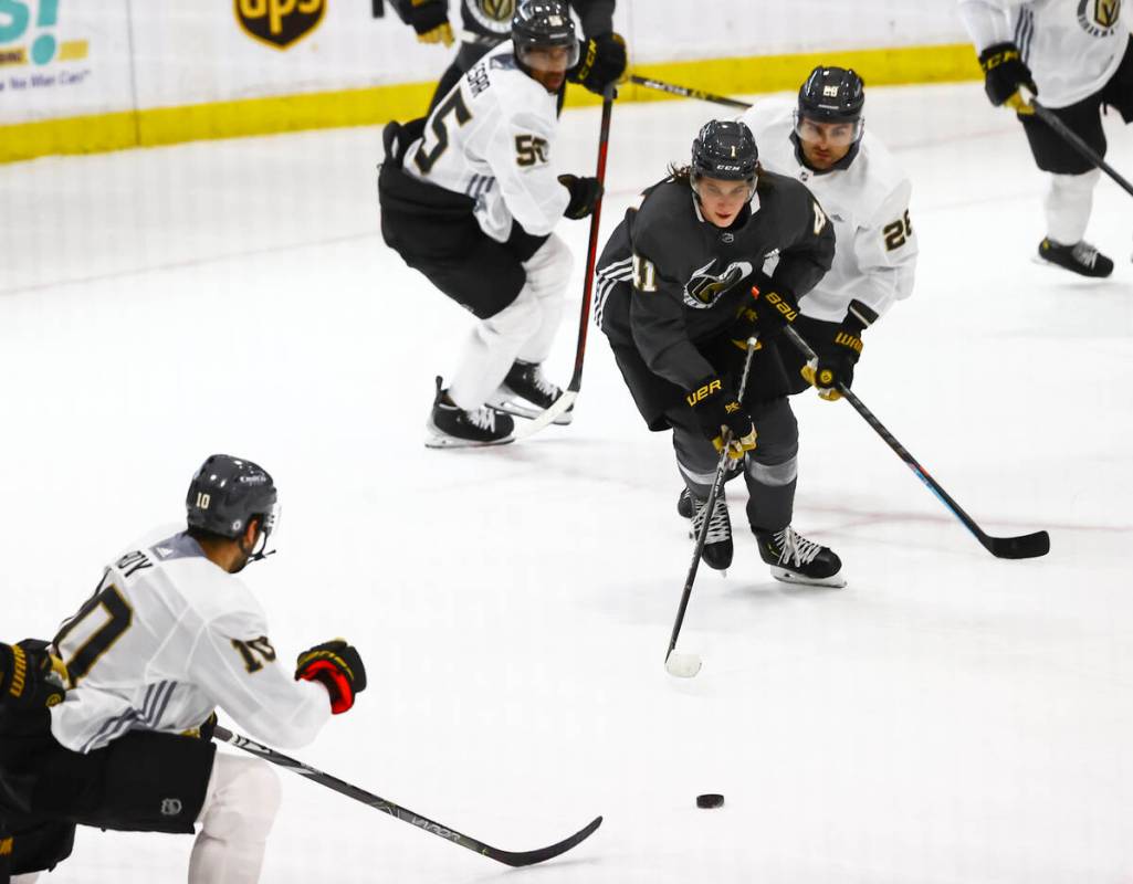 Golden KnightsÕ Nolan Patrick (41) watches the puck under pressure from Golden Knights' Wi ...