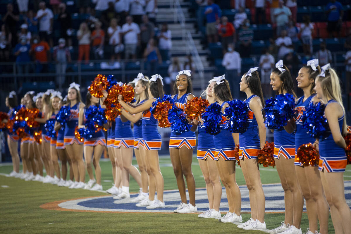 Cheerleader stand on the field before the start of a football game between Bishop Gorman and Ar ...