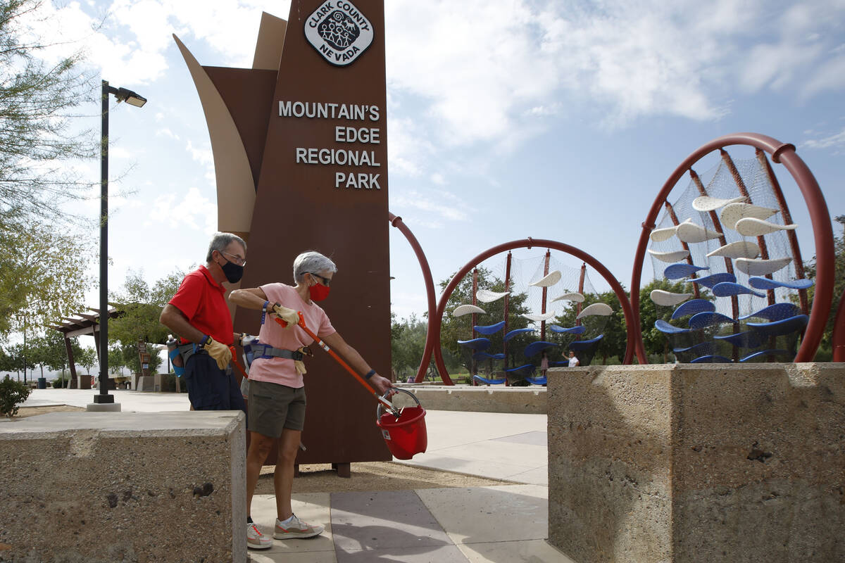 Kevin Cardiff of Friends of Red Rock Canyon and his wife Edith pick up trash during a park clea ...