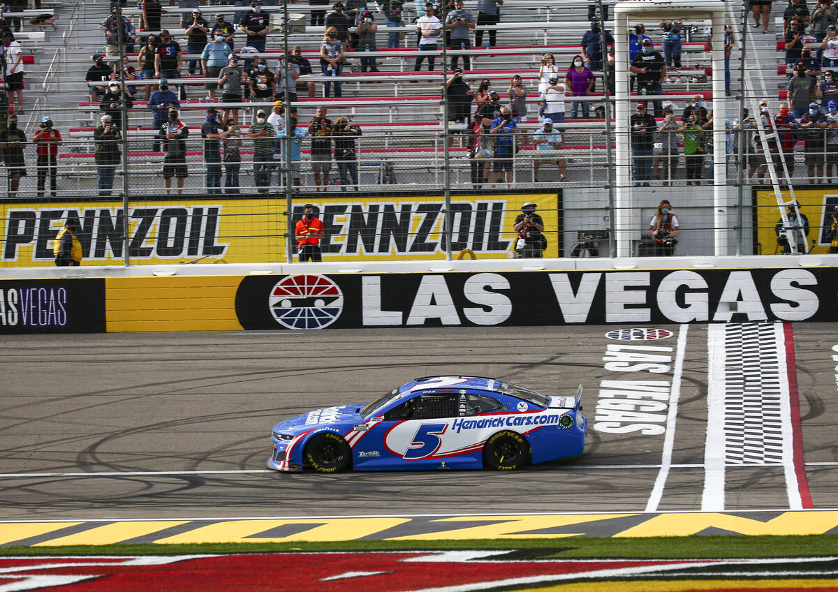 Kyle Larson crosses the start/finish line to win the NASCAR Cup Series Pennzoil 400 auto race a ...