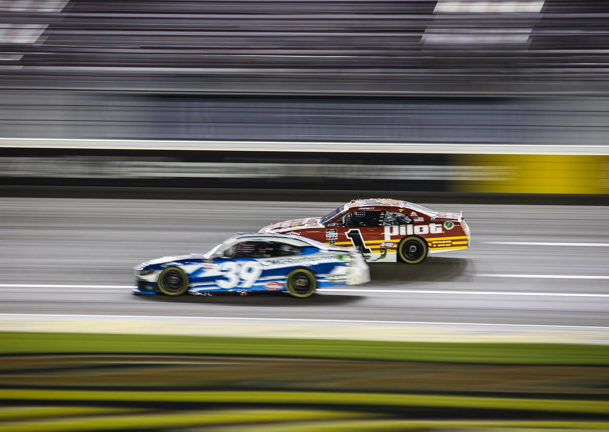 Josh Berry (1) passes Ryan Sieg (39) on his way to winning the Alsco Uniforms 302 NASCAR Xfinit ...