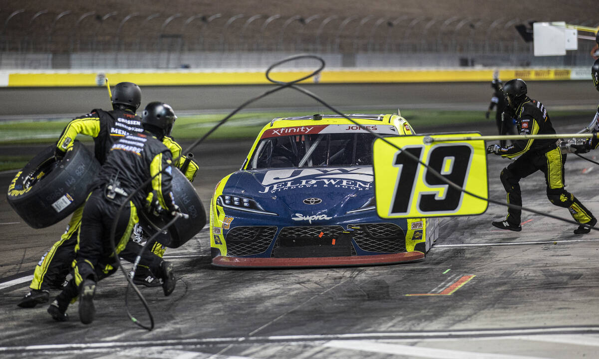 The pit crew works on Brandon Jones’ car during the Alsco Uniforms 302 NASCAR Xfinity se ...