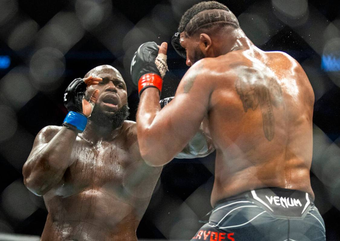 Jairzinho Rozenstruik, left, trades punches with Curtis Blaydes vs. during their heavyweight fi ...