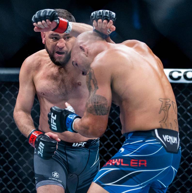 Nick Diaz throws a punch at Robbie Lawler in the first round during their welterweight fight in ...