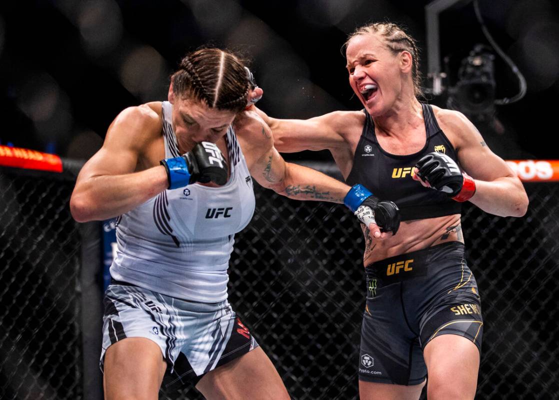 Lauren Murphy, left, is punched by Valentina Shevchenko in the fourth round of their women's fl ...