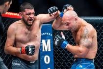 Nick Diaz, left, battles with Robbie Lawler in the third round during their welterweight fight ...