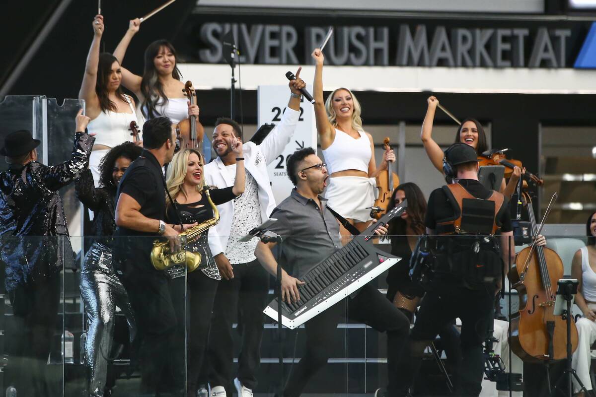 Otto Ehling (with keytar) and David Perrico's Pop Strings band perform at Allegiant Stadium in ...