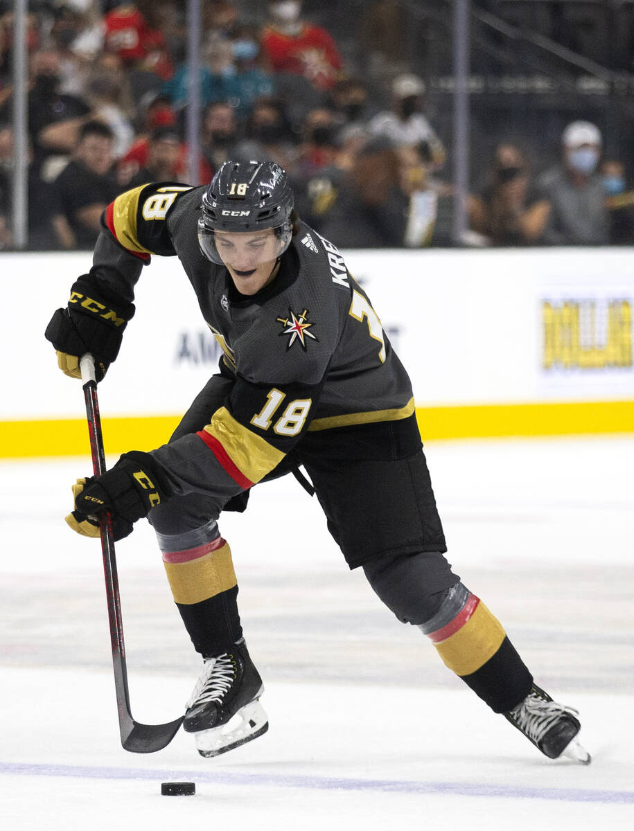 Golden Knights left wing Peyton Krebs (18) gains control of the puck during the first period of ...