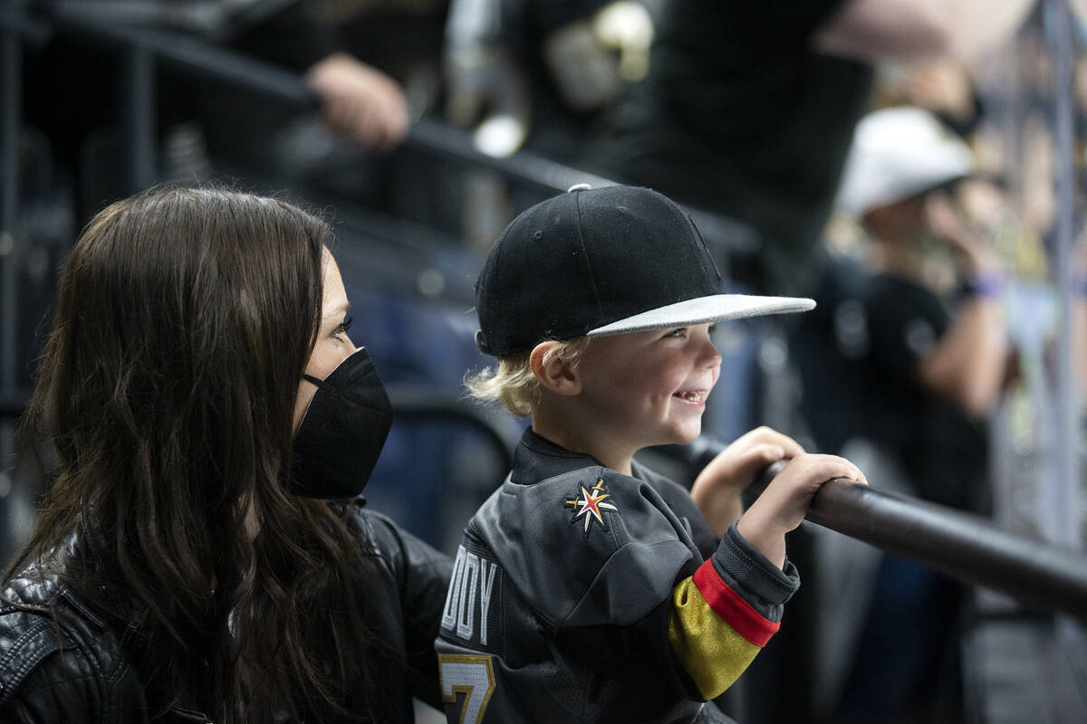 Laura Baertschi and Callan Baertschi, 2, watch their husband and father, Golden Knights forward ...