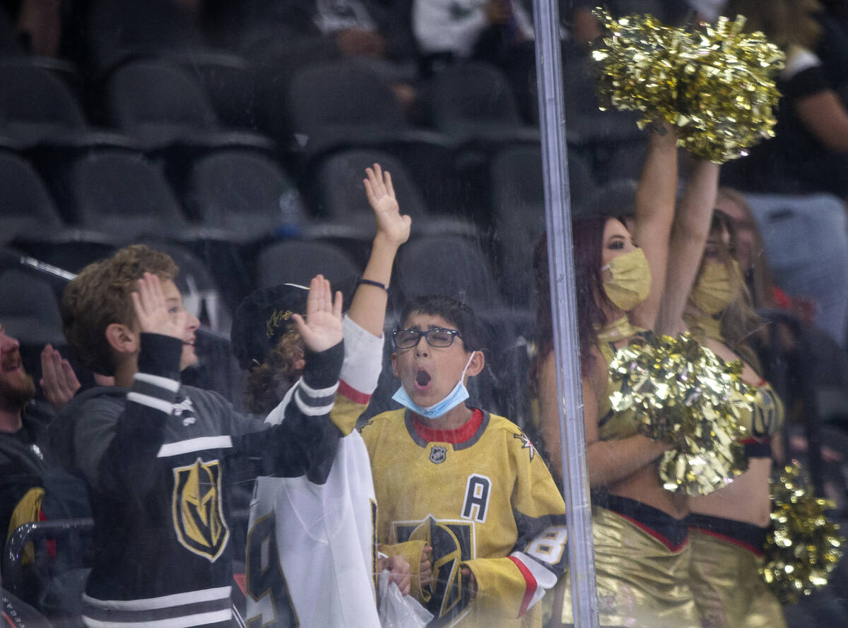 Fans cheer during a shootout following a preseason NHL hockey game between the Golden Knights a ...