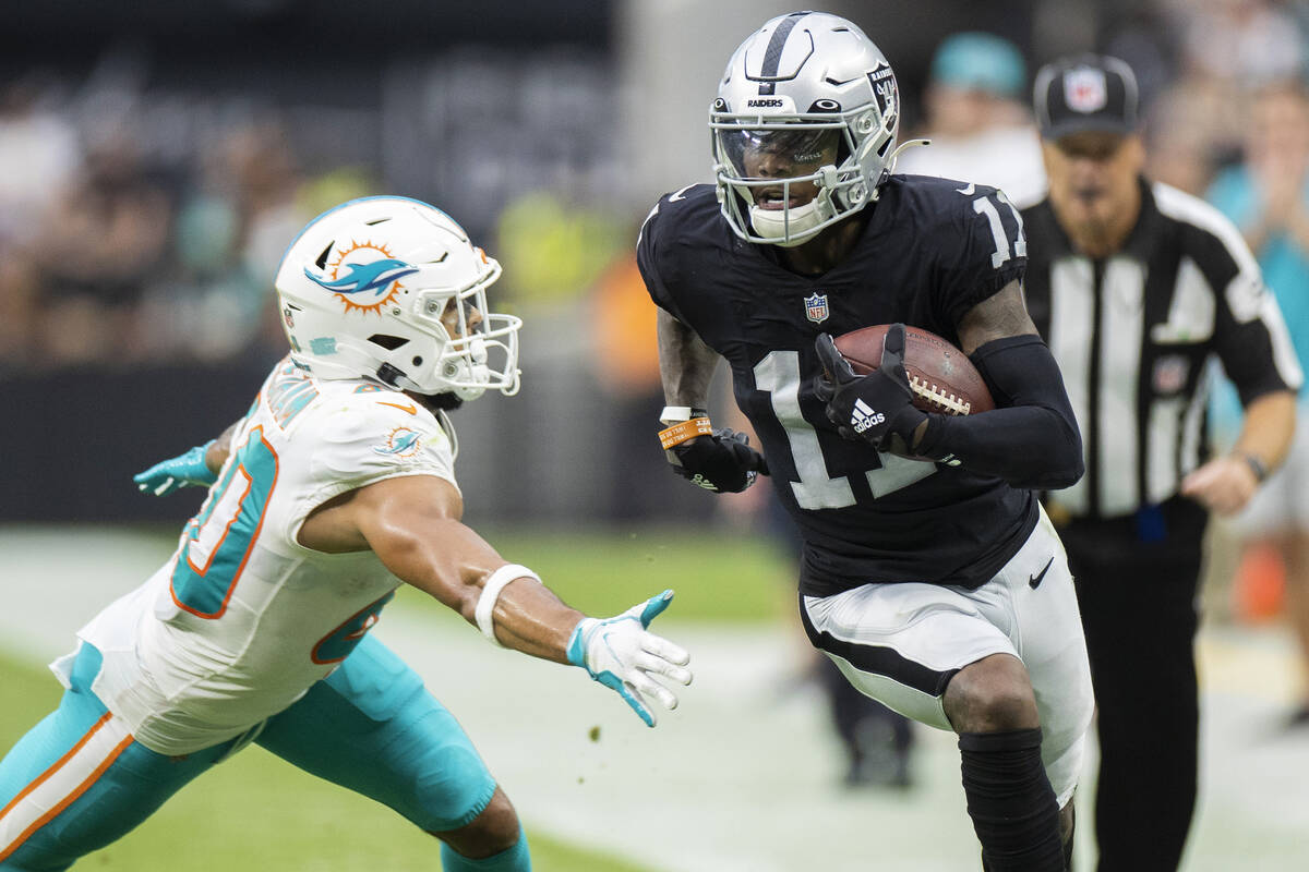 Las Vegas Raiders wide receiver Henry Ruggs III (11) breaks down the sideline past Miami Dolphi ...